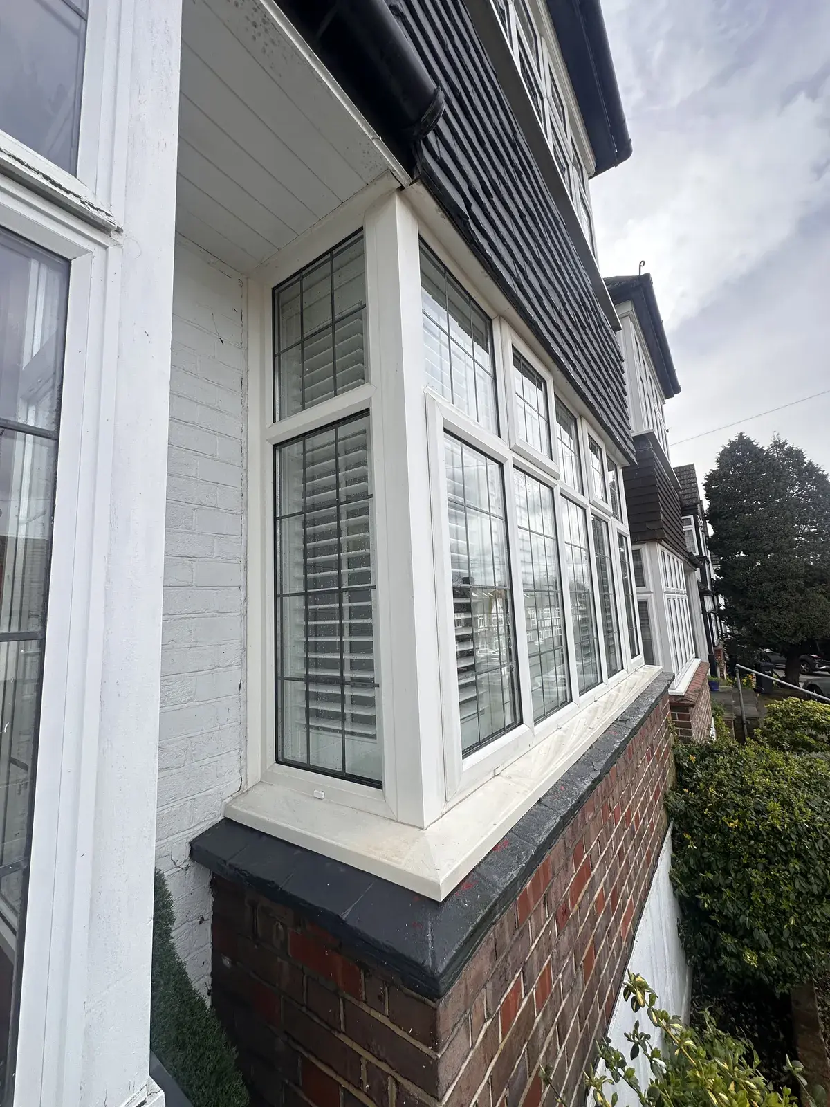 Freshly cleaned white bay window on a North London house