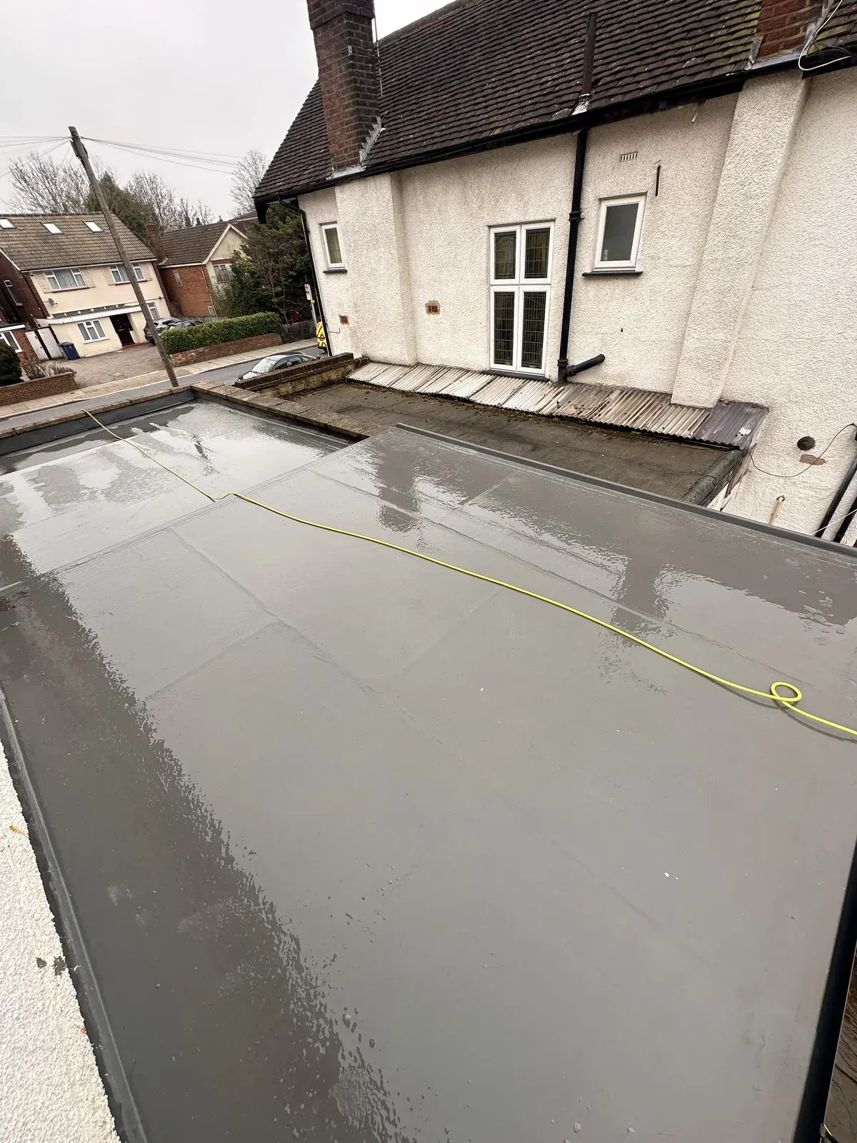Flat roof washed down and cleared of moss and debris