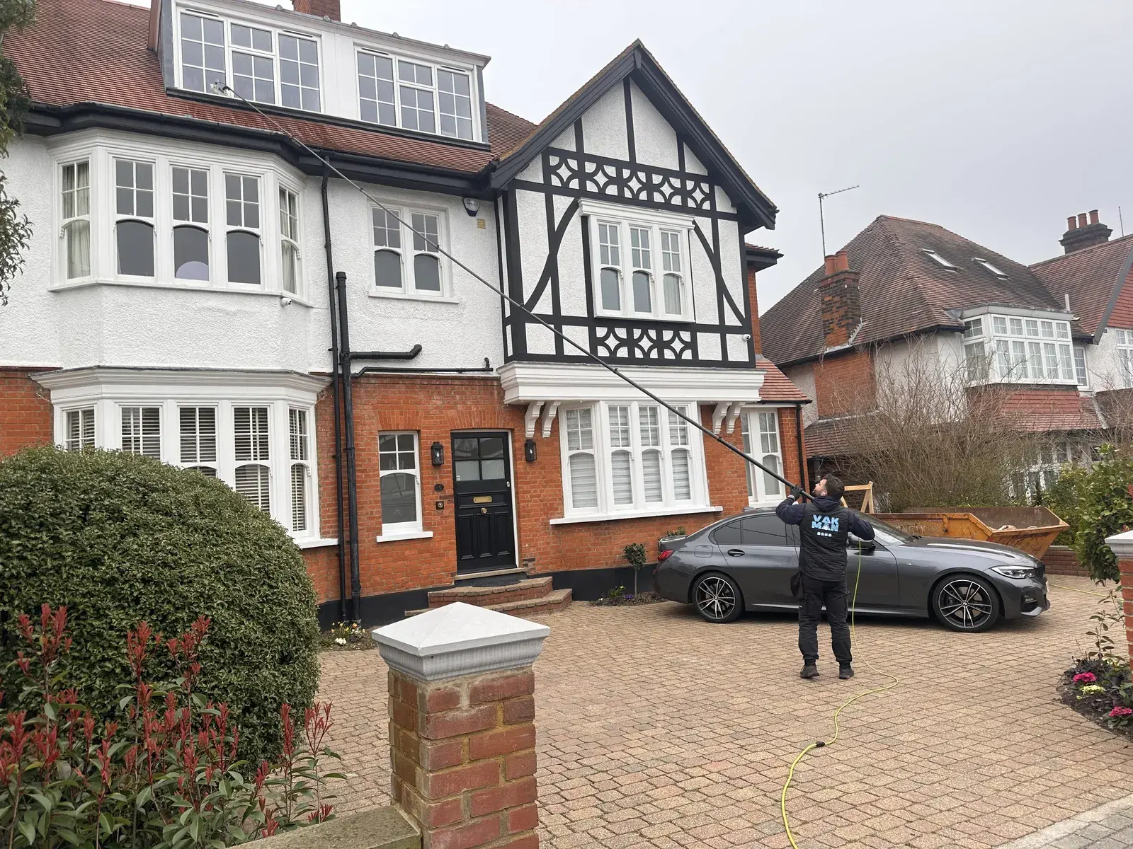 Chris outside a North London house after cleaning the windows and driveway