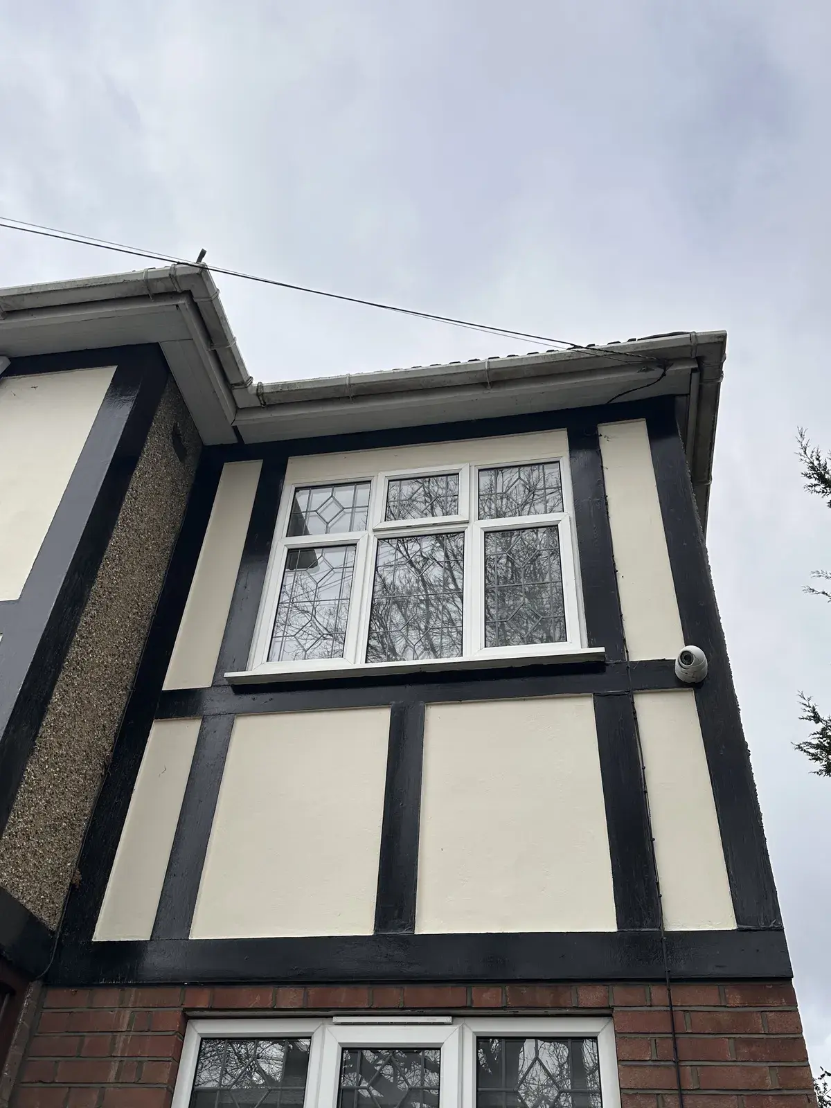 Freshly cleaned gable windows on a mock Tudor house in North London