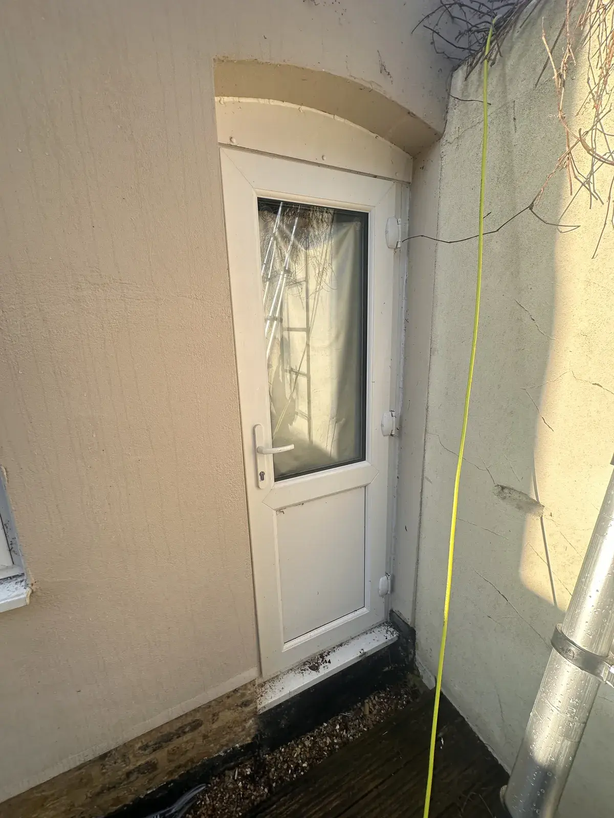 White uPVC door and surround before cleaning